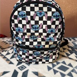 Stitch Black and white Chequered backpack.  Has a few stains on the front.